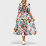 Jorė – Elegantiška gėlėta midi suknelė
